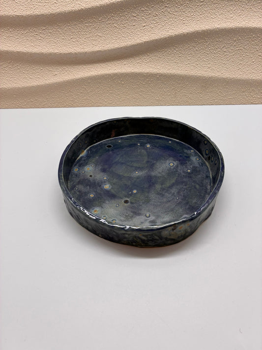 This handcrafted small round ceramic bowl features a compact and versatile form. Perfect for serving dips, sauces, nuts, or small snacks, it can also be used as a decorative dish for jewelry or accent pieces.