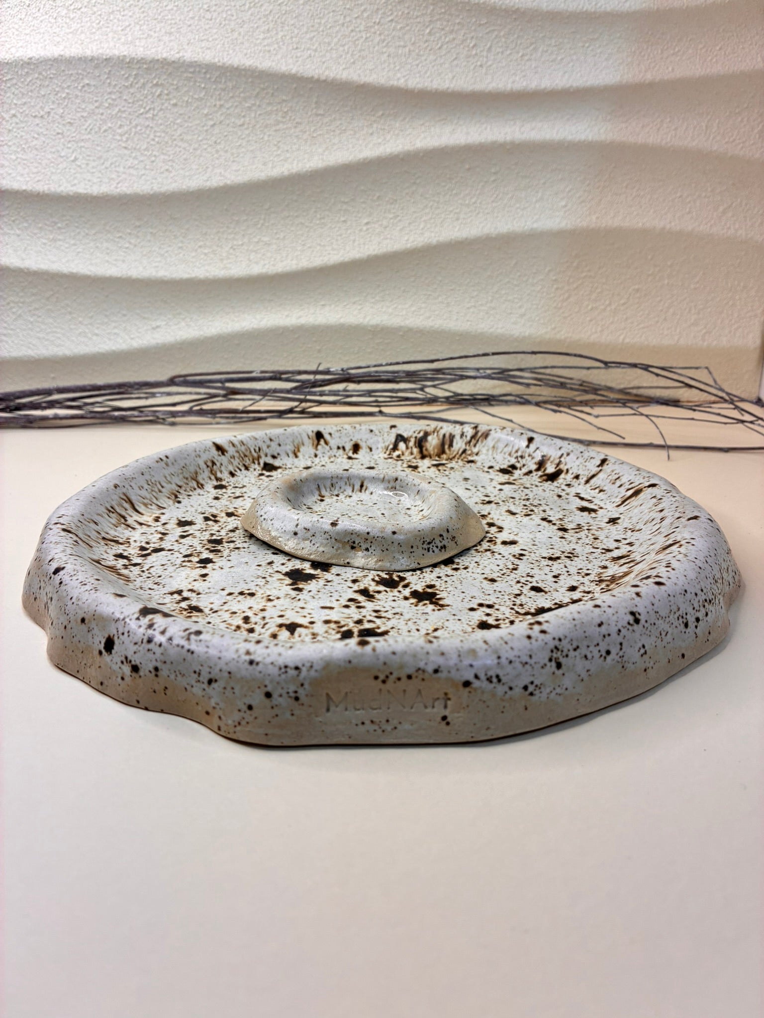 This handcrafted round platter comes with a separate small bowl that can be placed in the center or used independently. Perfect for serving snacks, chips, appetizers, or sauces, it allows you to present food beautifully while keeping dips or condiments conveniently contained. Each piece is carefully handmade, with subtle variations that highlight its artisanal character. Combining versatility with elegant design, it’s ideal for casual gatherings or stylish entertaining.