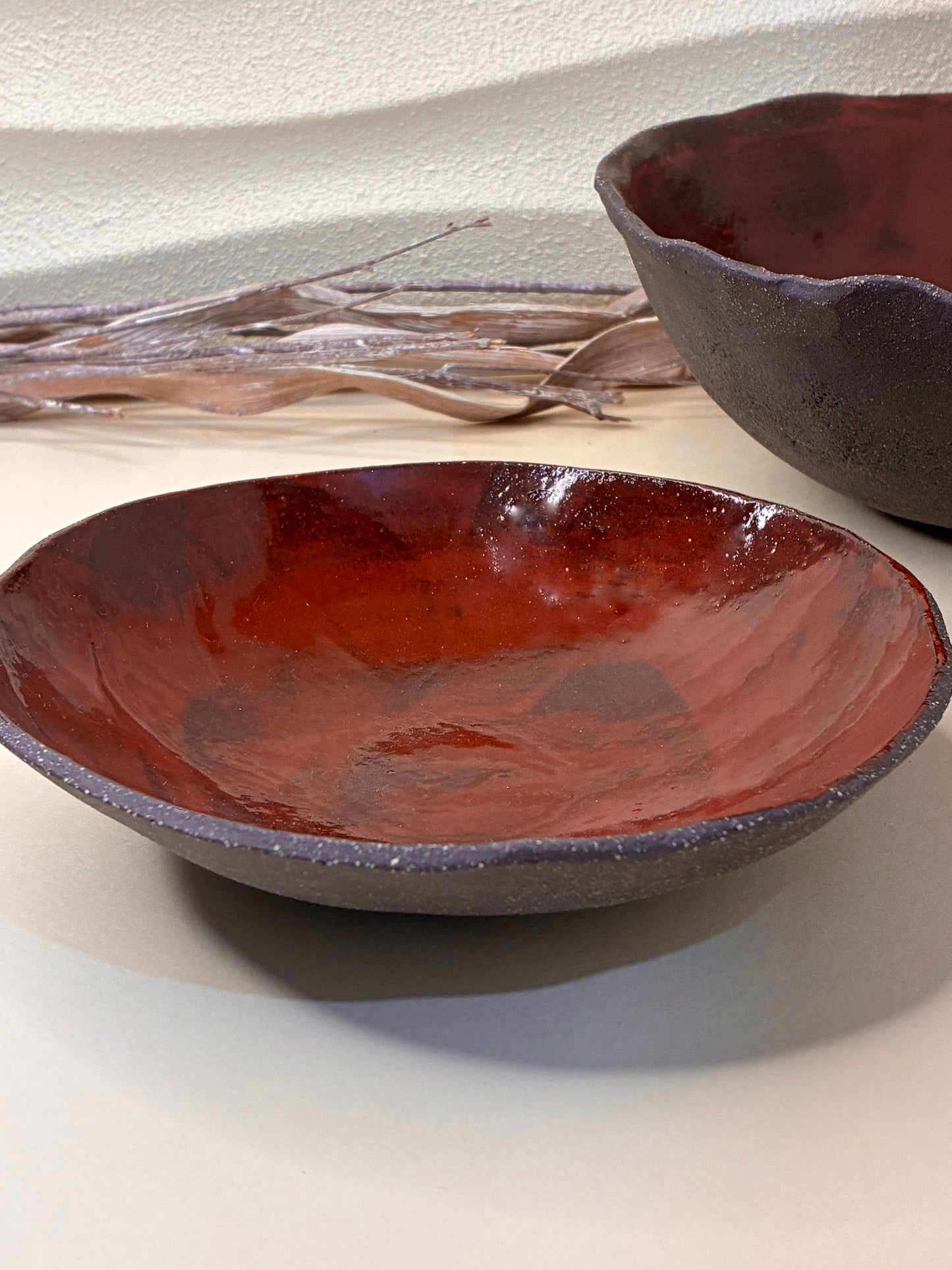 The Crimson Earth Serving Bowl combines handcrafted artistry with everyday functionality. Its deep, earthy red glaze adds warmth and character to your table, making it perfect for serving pasta, grains, or shared dishes. Smoothly finished and shaped by hand, this bowl brings natural elegance and a sense of grounded beauty to any meal.