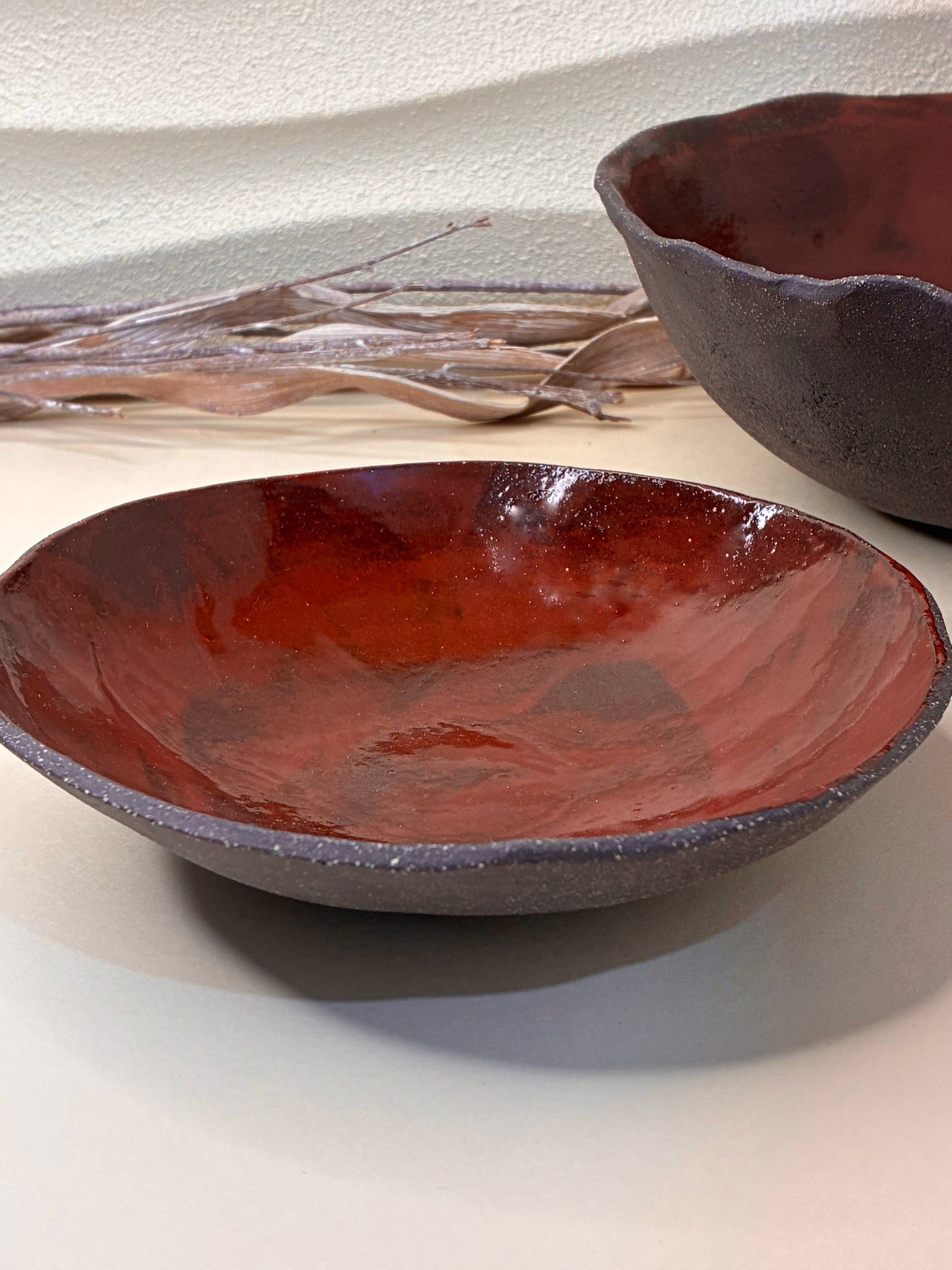 The Crimson Earth Serving Bowl combines handcrafted artistry with everyday functionality. Its deep, earthy red glaze adds warmth and character to your table, making it perfect for serving pasta, grains, or shared dishes. Smoothly finished and shaped by hand, this bowl brings natural elegance and a sense of grounded beauty to any meal.