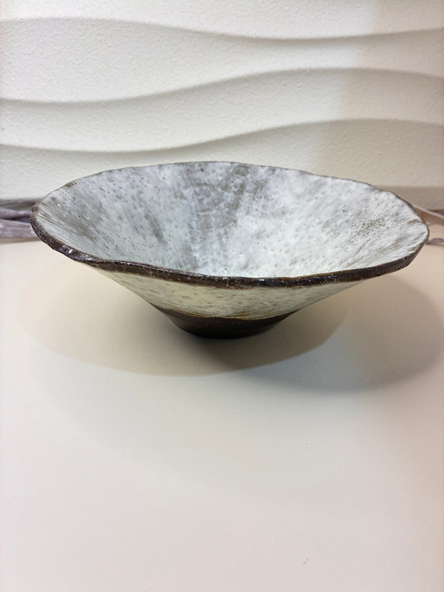Add an artisanal touch to your table with this handmade ceramic bowl. Its natural ash-white glaze flows over a rich earthy brown base, creating a beautifully organic look. Each piece is unique, featuring hand-sculpted edges and a soft matte finish. Perfect for serving salads, fruits, or as a statement décor item.



Details:

Material: Stoneware clay

Finish: Ash-white glaze with brown clay base

Handmade — each piece is one of a kind

Approx. use: Serving or decorative