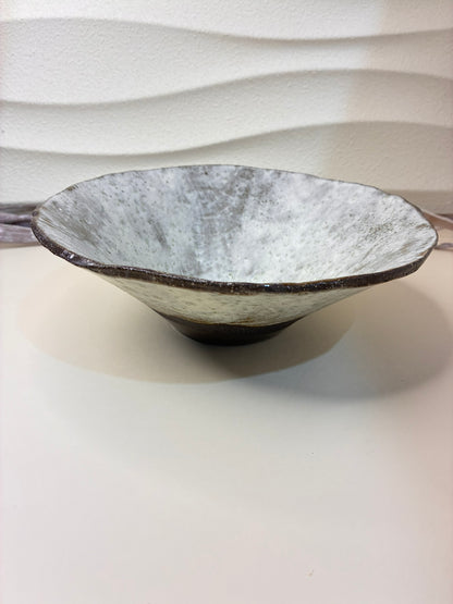 Add an artisanal touch to your table with this handmade ceramic bowl. Its natural ash-white glaze flows over a rich earthy brown base, creating a beautifully organic look. Each piece is unique, featuring hand-sculpted edges and a soft matte finish. Perfect for serving salads, fruits, or as a statement décor item.



Details:

Material: Stoneware clay

Finish: Ash-white glaze with brown clay base

Handmade — each piece is one of a kind

Approx. use: Serving or decorative