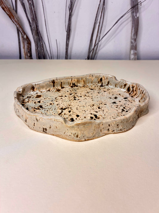 This handcrafted stoneware ashtray is designed specifically for holding ash and cigarettes while maintaining a refined, minimal aesthetic. Made by hand, each piece features subtle variations that highlight its artisanal character. Both decorative and functional, it offers a durable, heat-resistant surface suitable for everyday use.